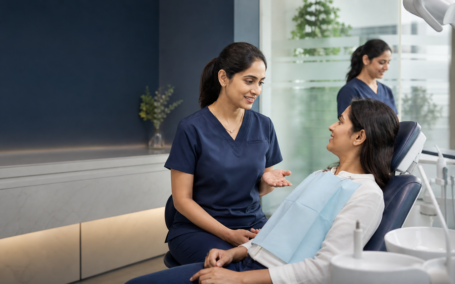 Dentist consulting a patient at Vedant Dental Care